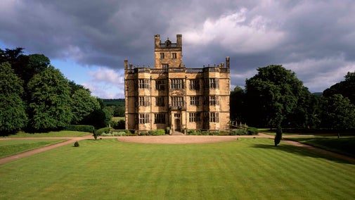 A view of the South Front of Gawthorpe Hall set in it's grounds on a stormy day